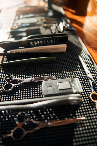 istock Black rubber mat with barber tools in barbershop 1283605774
