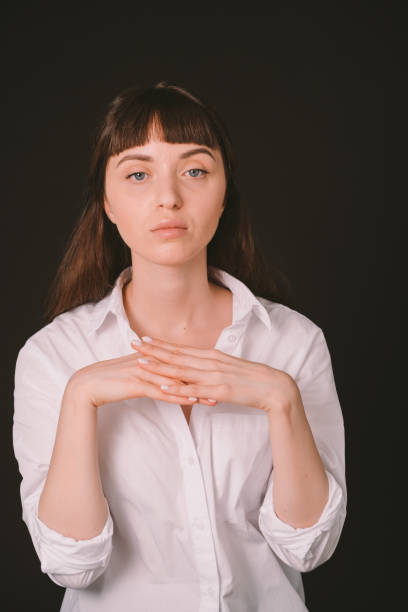 istock Studio portrait of a young woman against plain black background 1283606002