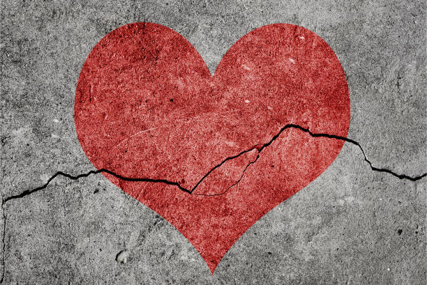 istock Damaged wall. Gray background with crack 1283606135
