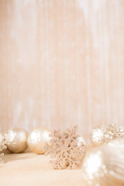 istock Ecru toned image of silver/gold Christmas ornaments. 1283607915