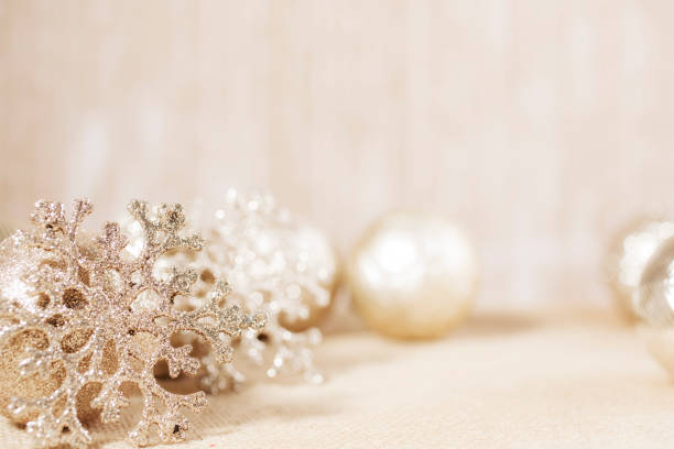 istock Ecru toned image of silver/gold Christmas ornaments. 1283607926