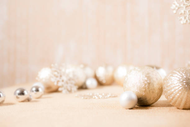 istock Ecru toned image of silver/gold Christmas ornaments. 1283607949