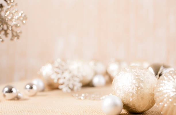istock Ecru toned image of silver/gold Christmas ornaments. 1283607950