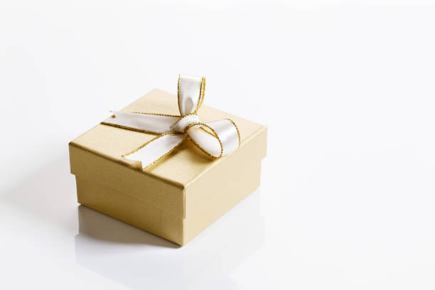 istock Gift box with golden color on white background 1283613379