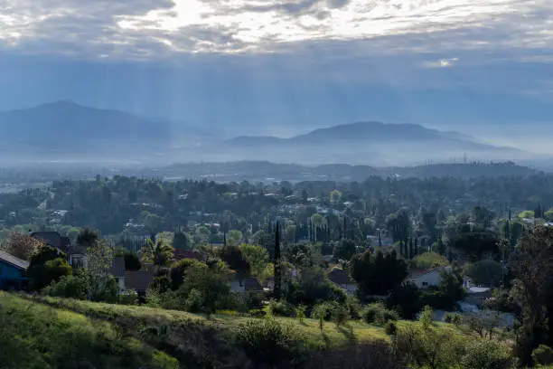Morning sunbeams and strom clouds above the San Fernando Valley area of Los Angeles in Southern California.