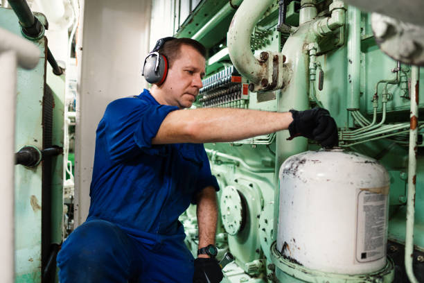istock Marine engineer officer controlling vessel enginesand propulsion in engine control room ECR 1283614117