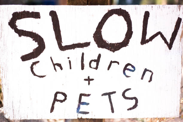 istock Handmade Sign Reading: SLOW Children and Pets 1283614236