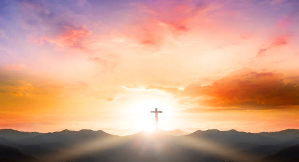 istock Good Friday concept: Silhouette cross on mountain sunset backgroundGood Friday concept: Silhouette cross on mountain sunset background 1283615065