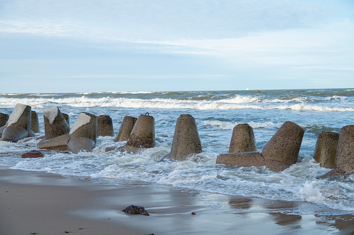 Concrete wave-breakers on the seashore of the Baltic Sea, Kaliningrad region, Russia.