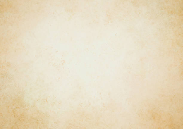 Photo of Old brown paper parchment background design with distressed vintage stains and ink spatter and white faded shabby center, elegant antique beige color