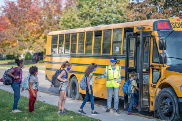 istock Students heading to school wearing masks 1283623157