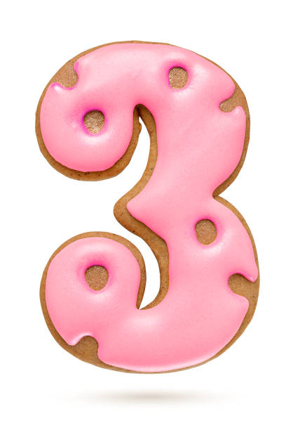 istock Number 3 pink gingerbread biscuit isolated on white. 1283624256