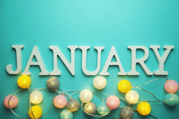 istock January alphabet letter with cotton ball LED decoration on blue background 1283624290