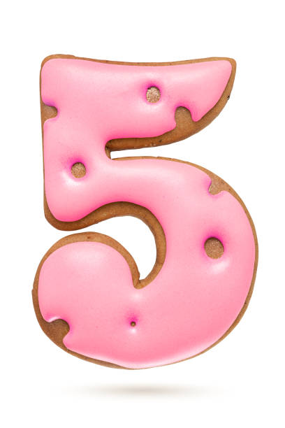 istock Number 5 pink gingerbread biscuit isolated on white. 1283624838