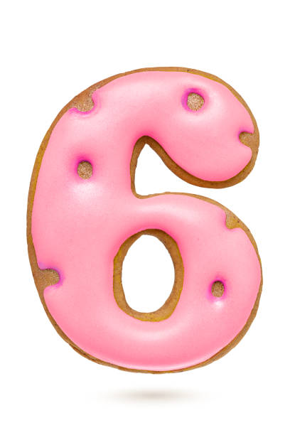 istock Number 6 pink gingerbread biscuit isolated on white. 1283624930