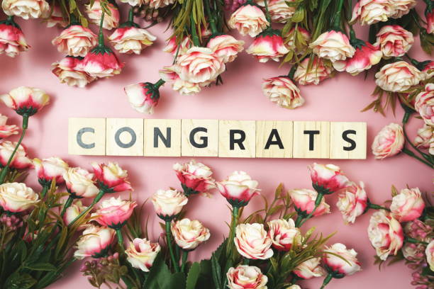 istock Congrats alphabet letter with Blooming flower on pink background 1283625052