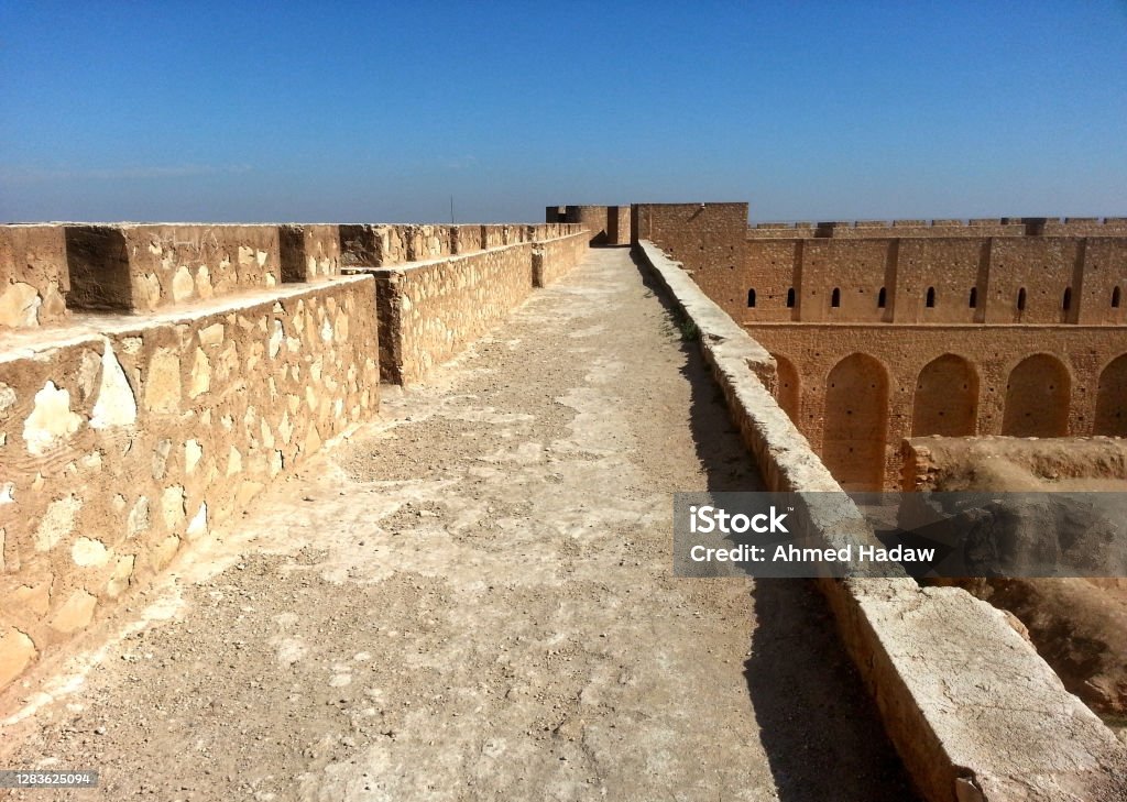 The Fortress of Al-Ukhaidir or Abbasid palace of Ukhaider is located roughly 50 km south of Karbala, Iraq. It is a large, rectangular fortress erected in 775 AD with a unique defensive style. Iraq Stock Photo