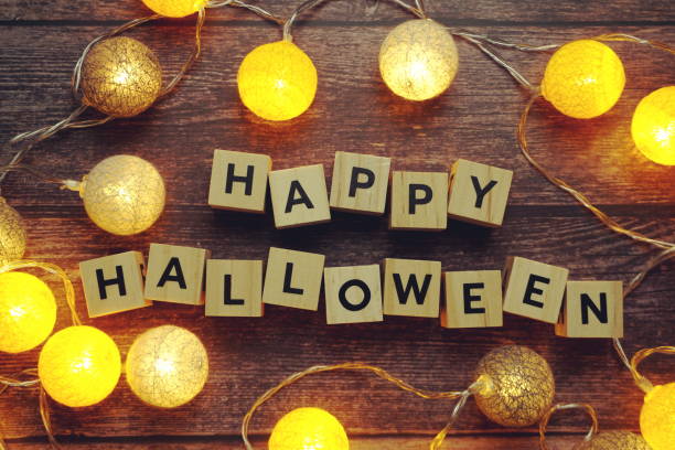 istock Happy Halloween alphabet letter on wooden background 1283626566