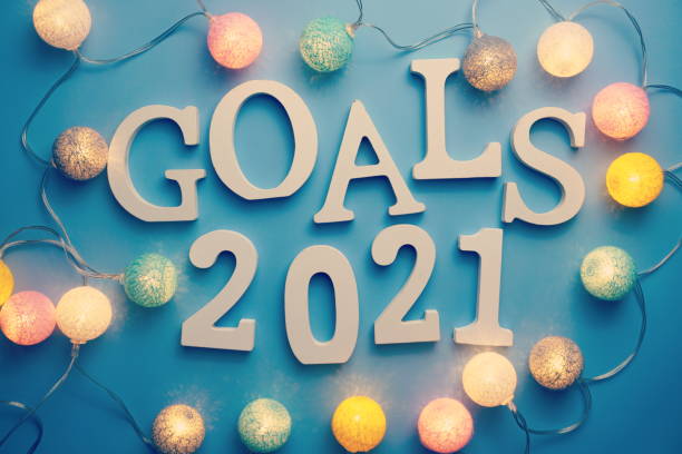 istock Goals for 2021 alphabet letter on blue background 1283628442