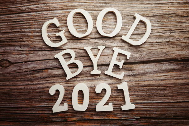 istock Goodbye 2021 alphabet letter on wooden background 1283628478