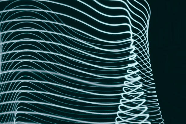 istock Abstract blue green light swirl trail motion neon painting 1283630214