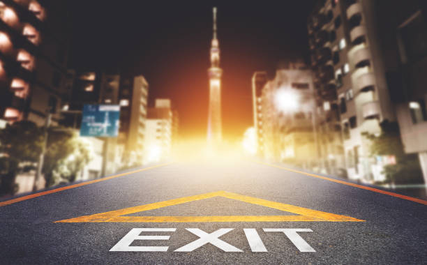 istock Road with Exit sign leading to a hope and light in Tokyo City, pathway to solution and freedom concept. 1283630986