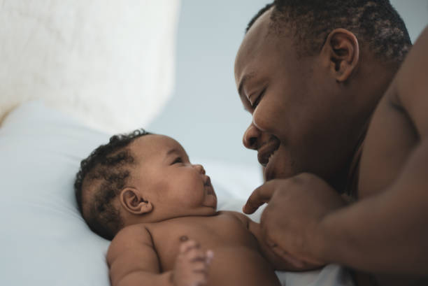 istock Young father consoling his baby daughter 1283632887