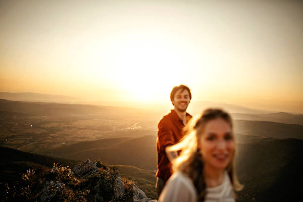 istock Couple walking on mountain, having a good time 1283633030