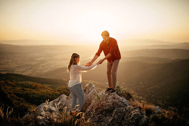 istock Couple walking on mountain, having a good time 1283633958