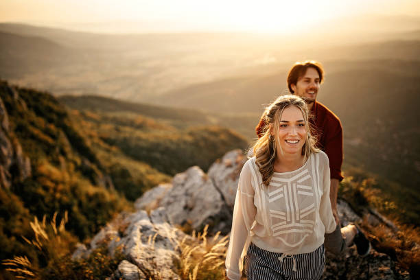 istock Couple walking on mountain, having a good time 1283633978
