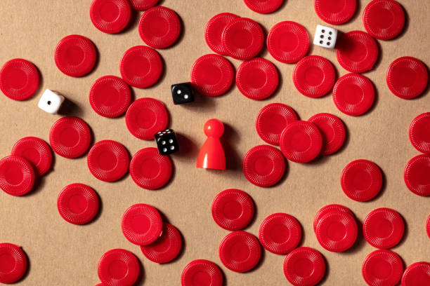 istock Board games flat lay, shot from the top. Red playing pieces and dice 1283634127