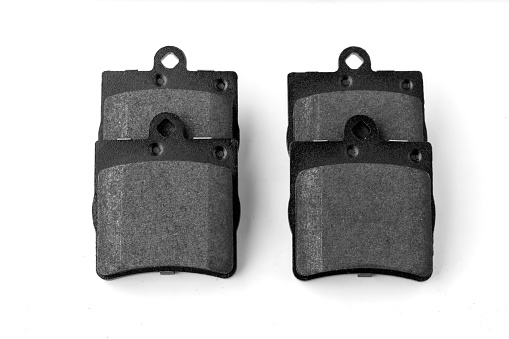 New car brake pads isolated on white background include clipping path , Car spare parts and maintenance concept