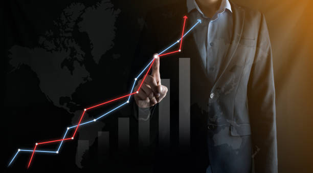 istock Businessman in suit draws with his finger pointing arrow graph. Business development to success, profit and growing.Business, Technology, Internet and network concept 1283636014