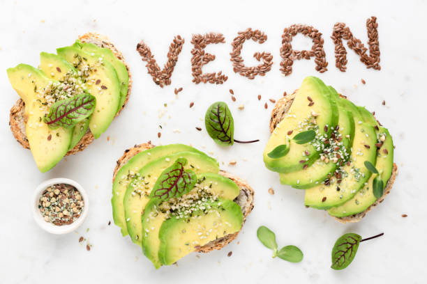 istock Vegan avocado toast with seeds and micro green sprouts 1283636812