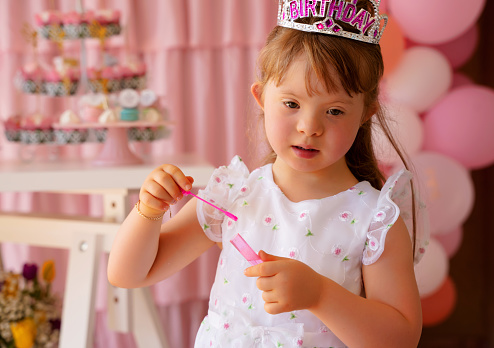 Little princess birthday blowing bubbles