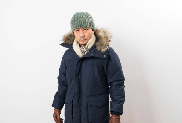 istock Handsome asian man dressed with winter clothing 1283640343