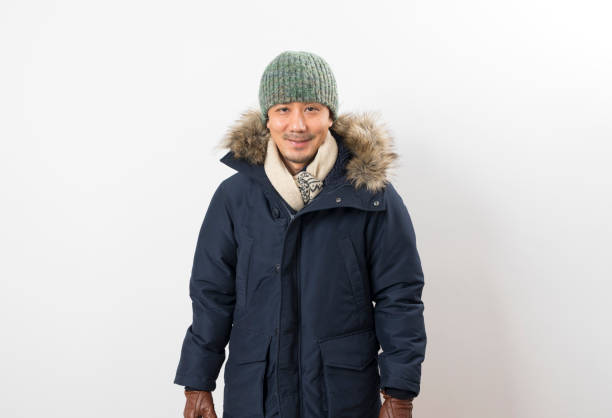 istock Handsome asian man dressed with winter clothing 1283640344