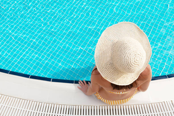 istock Woman relaxing in swimming pool 1283665493
