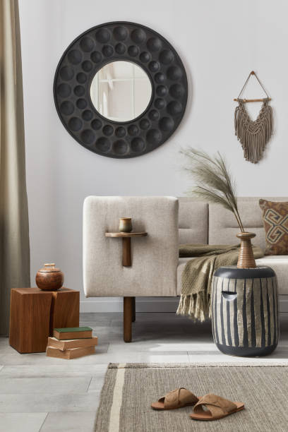 istock Elegant ethnic composition of living room interior with design coffee table, sofa, decoration , flowers in vase and acceessories in modern home decor. Template. Details. 1283665511