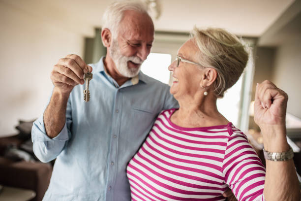 istock Senior couple with house key 1283666151