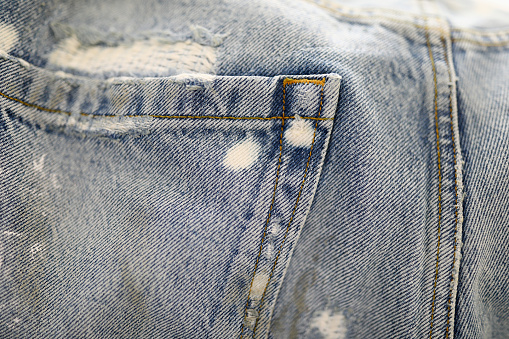 Denim back pocket and line seams. Sewing of youth casual clothing concept