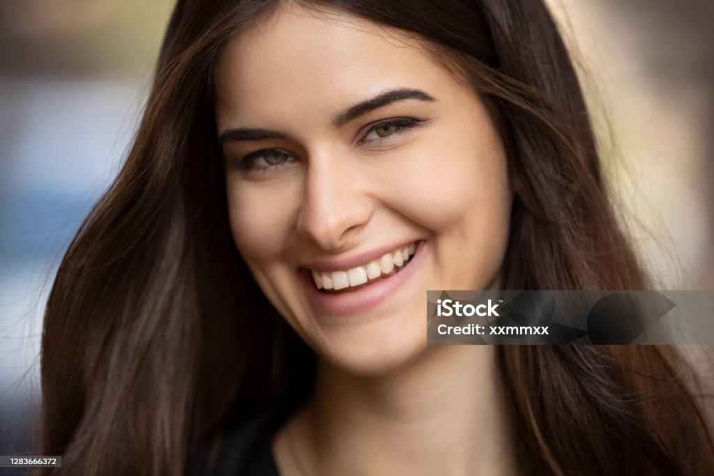 Portrait of cute happy beautiful young brunette girl Portrait of cute happy beautiful young brunette girl. This file is cleaned and retouched. Adult Stock Photo