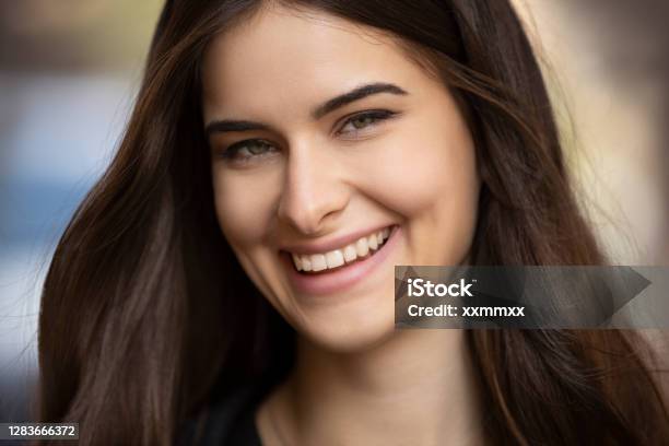 Portrait Of Cute Happy Beautiful Young Brunette Girl Stock Photo - Download Image Now