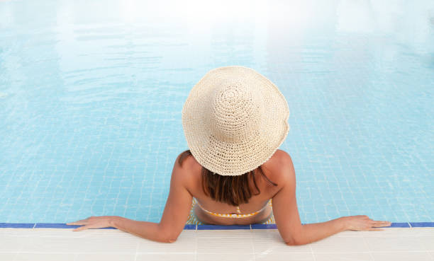 istock Woman relaxing in swimming pool 1283666492