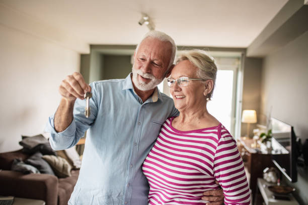 istock Senior couple with house key 1283666912