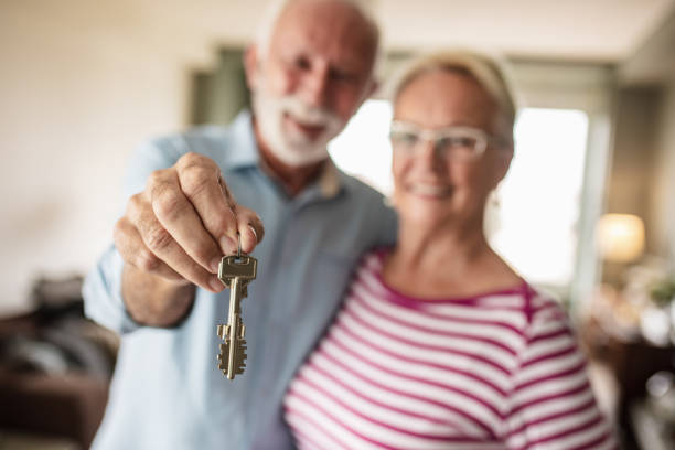 istock Senior couple with house key 1283666926