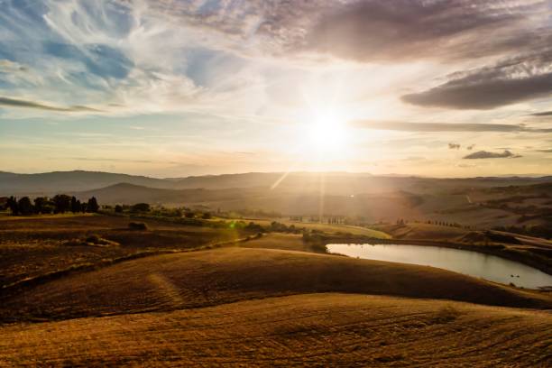 istock Italian Landscape Panorama with Silhouetted Mountains and Cloudscape 1283668818