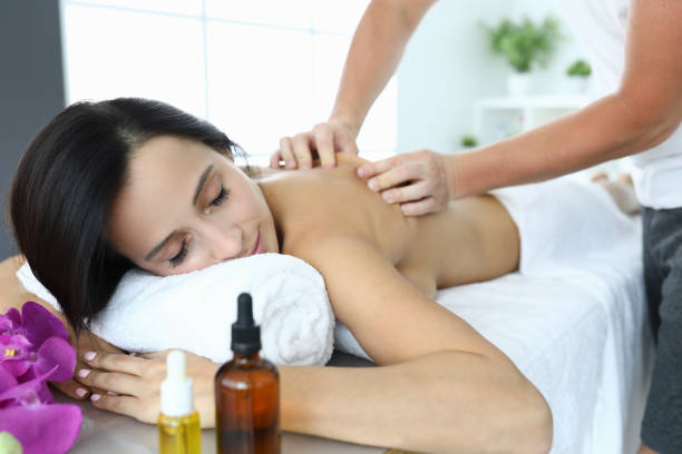 istock Woman in spa is being massaged by masseur. 1283669080