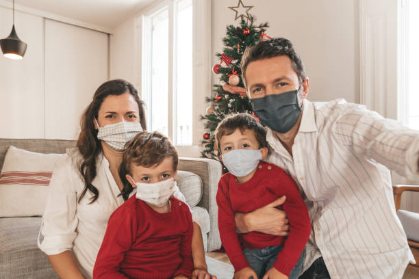 istock Family posing with christmas tree 1283669724