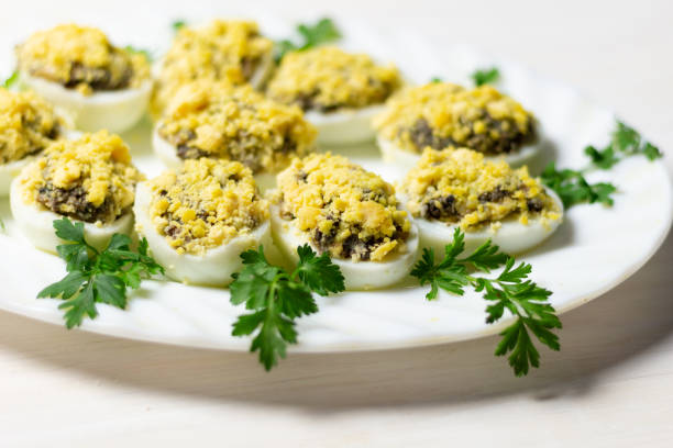 istock stuffed eggs with mushrooms, yolk and parsley on white plate 1283669974